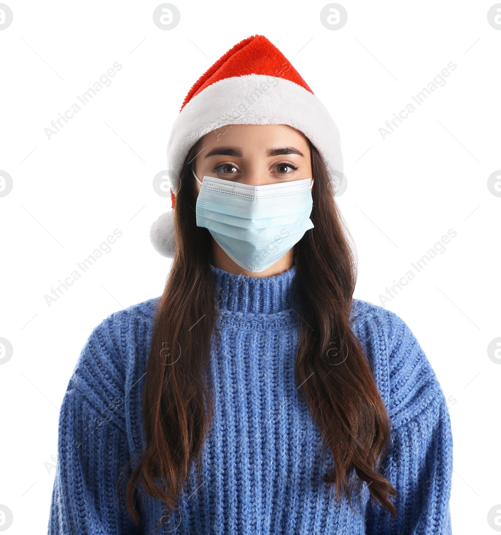 Photo of Beautiful woman wearing Santa Claus hat and medical mask on white background