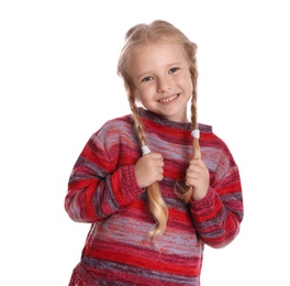 Cute little girl in warm sweater on white background. Winter season