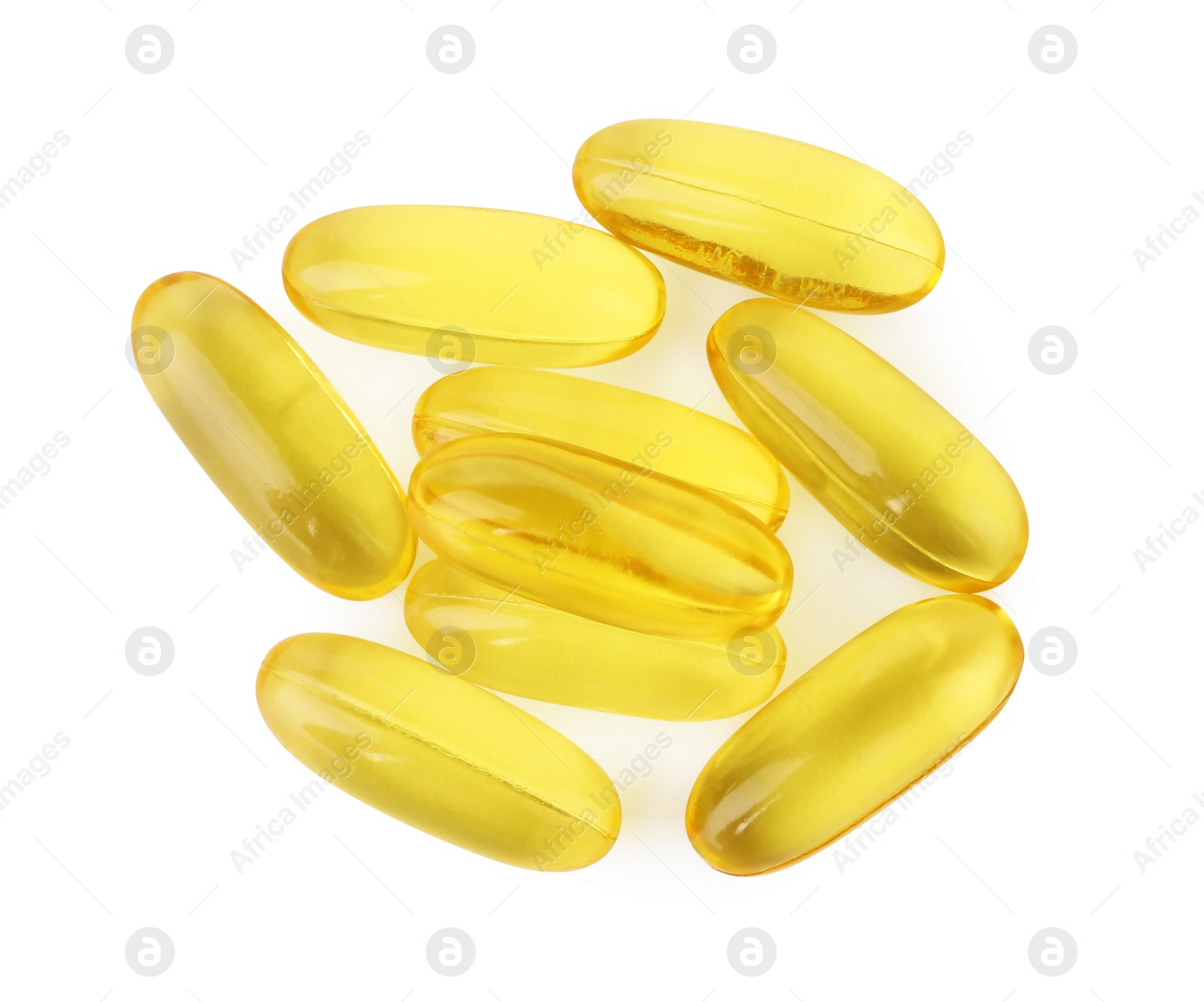 Photo of Many yellow vitamin capsules isolated on white, top view