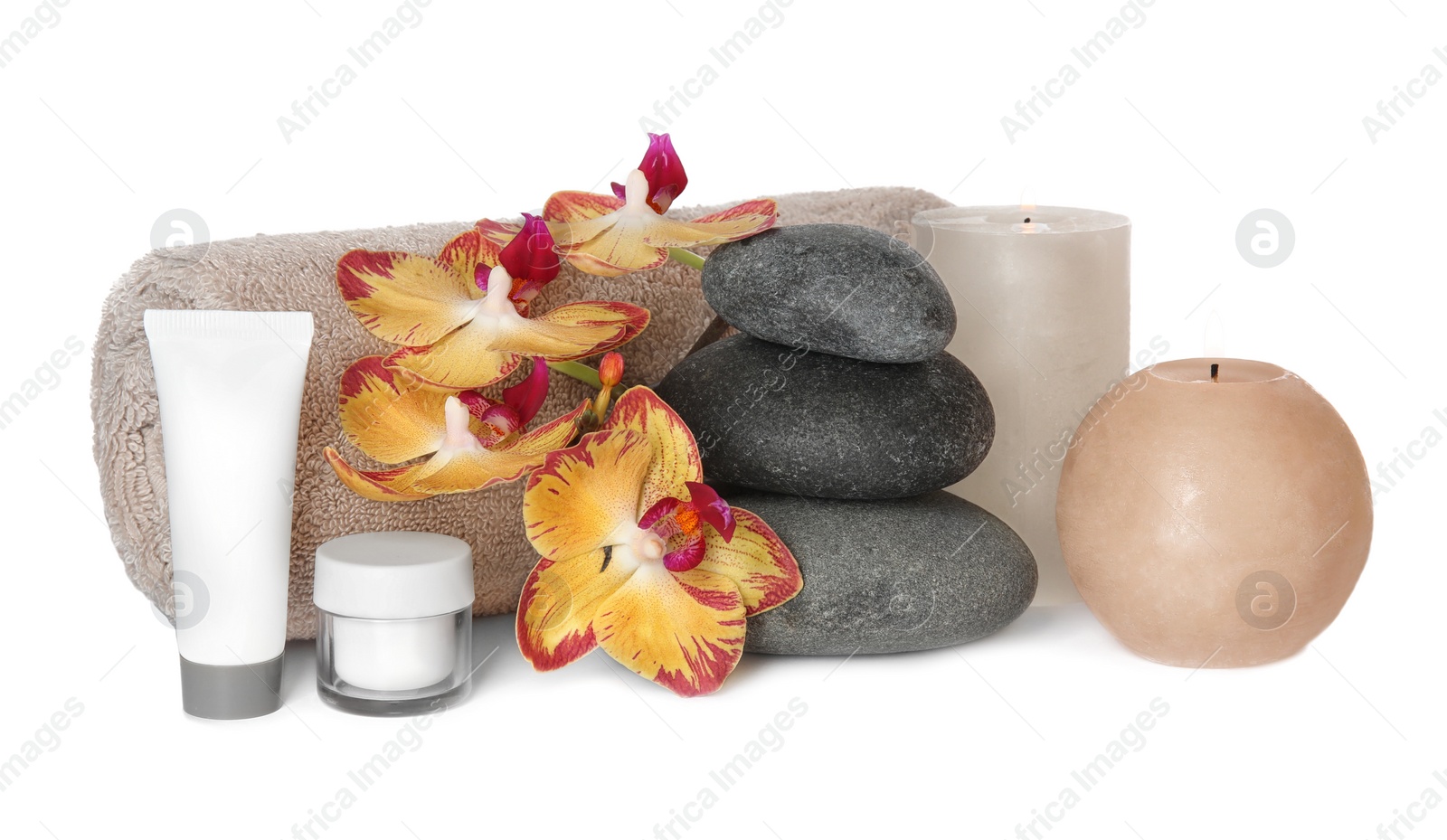 Photo of Composition with spa stones and candles on white background