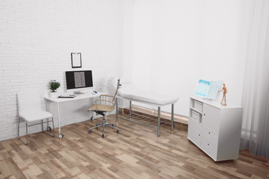 Photo of Interior of modern medical office. Doctor's workplace