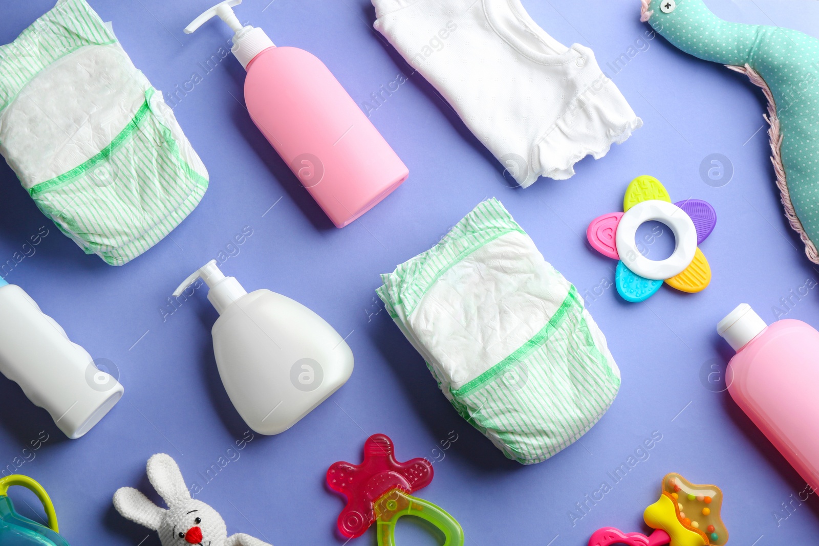 Photo of Flat lay composition with baby accessories on color background