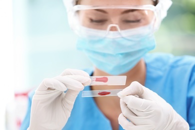 Scientist working with blood sample in laboratory