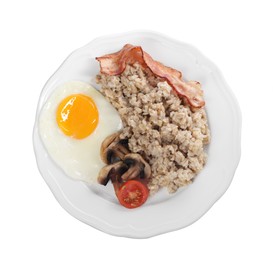 Tasty boiled oatmeal with fried egg, mushrooms, bacon and tomato isolated on white, top view