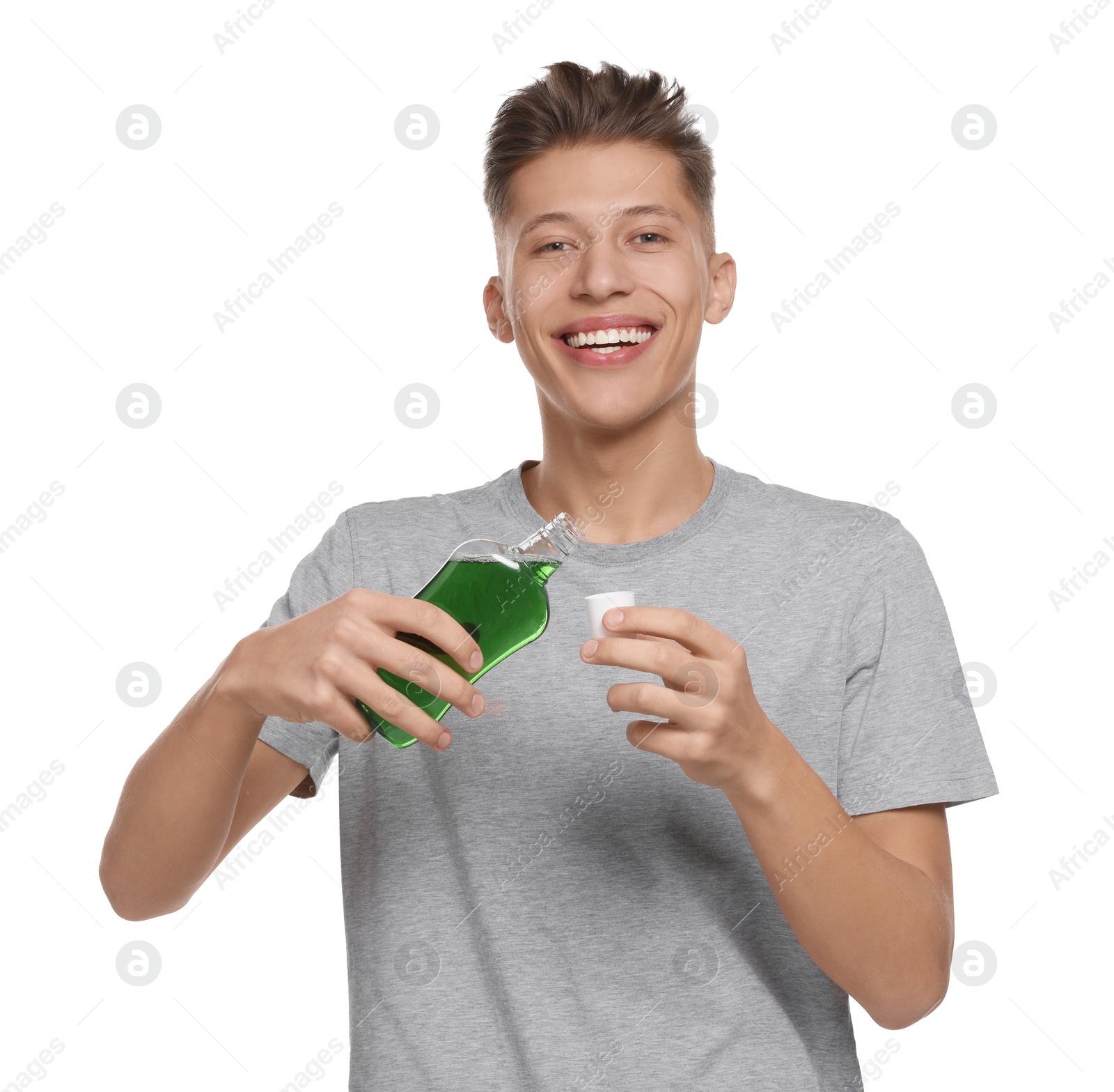 Photo of Young man with mouthwash on white background