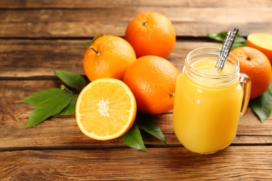 Photo of Orange juice and fresh fruits on wooden table