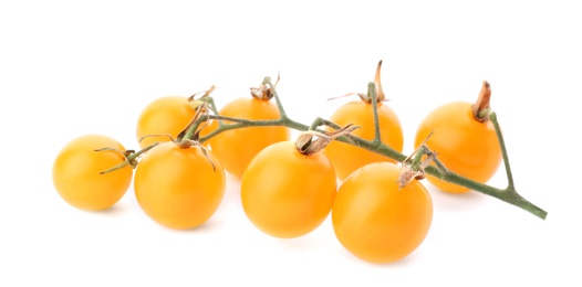 Photo of Branch of ripe yellow cherry tomatoes on white background