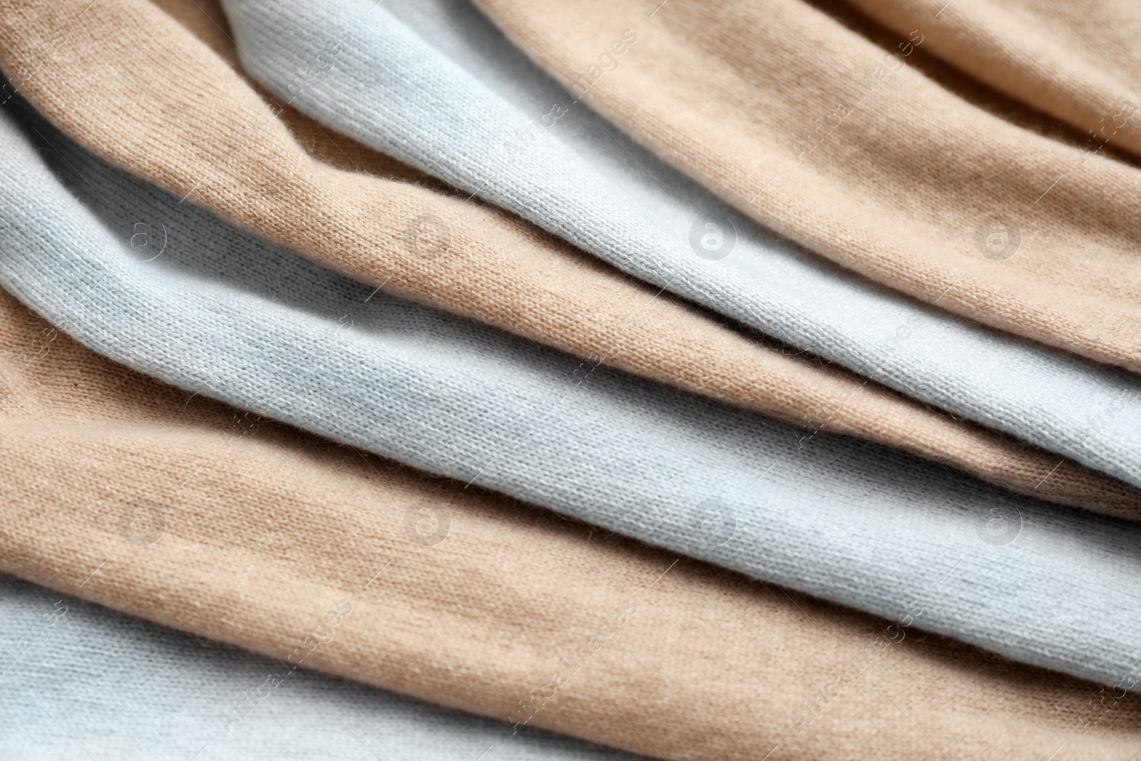 Photo of Different cashmere clothes as background, closeup view