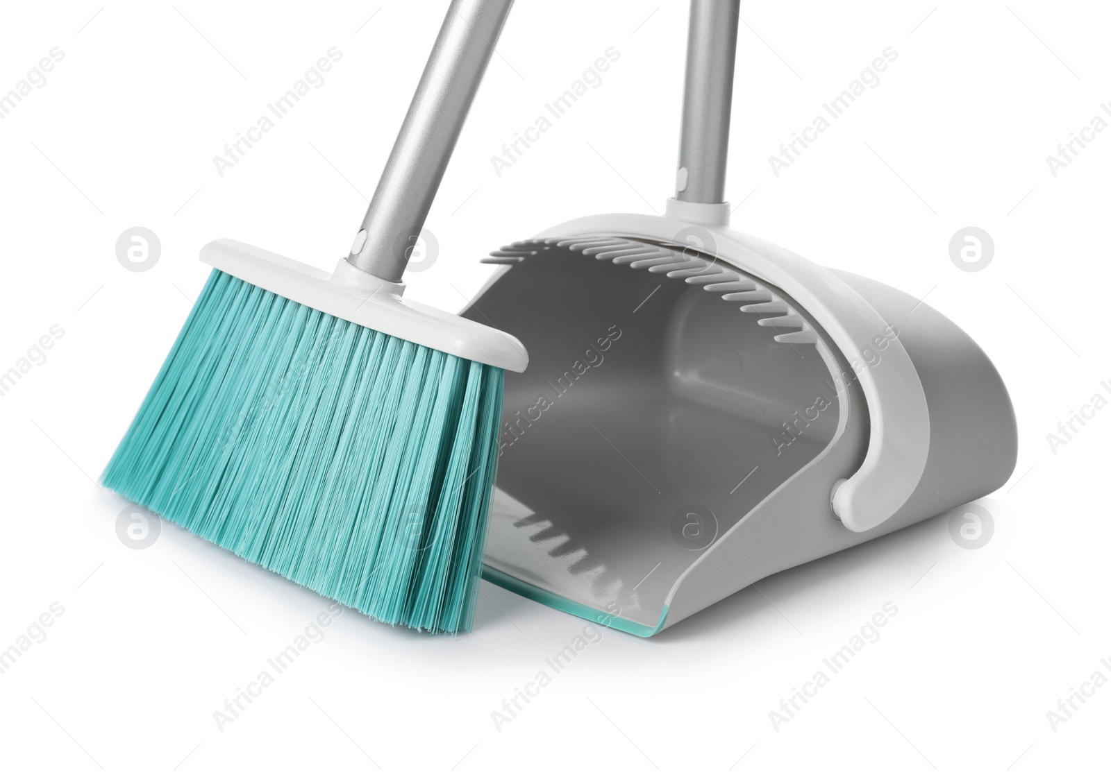 Photo of Plastic broom and dustpan on white background