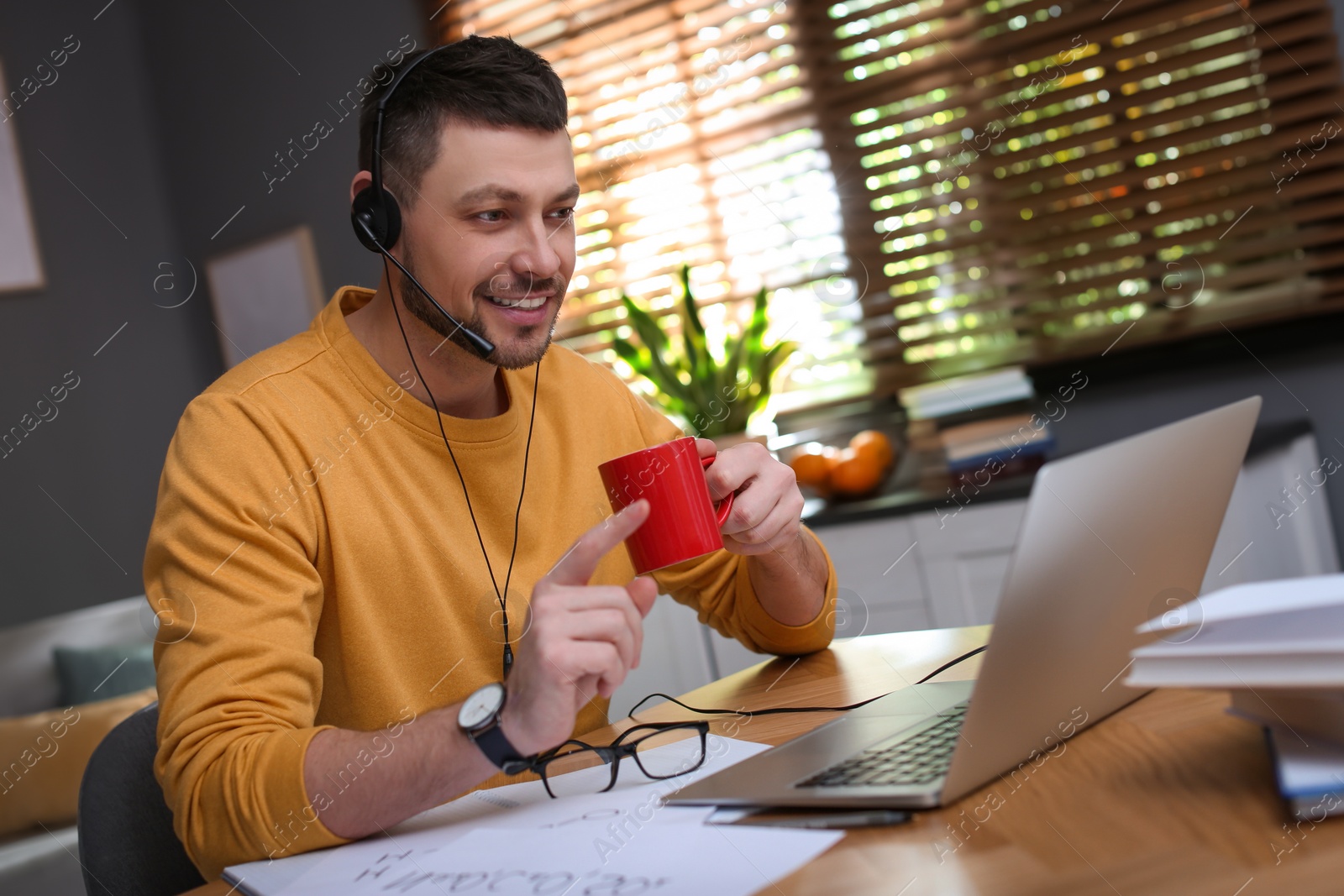 Photo of Teacher conducting online lesson at home during COVID-19 quarantine