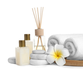 Beautiful spa composition with reed diffuser on white background