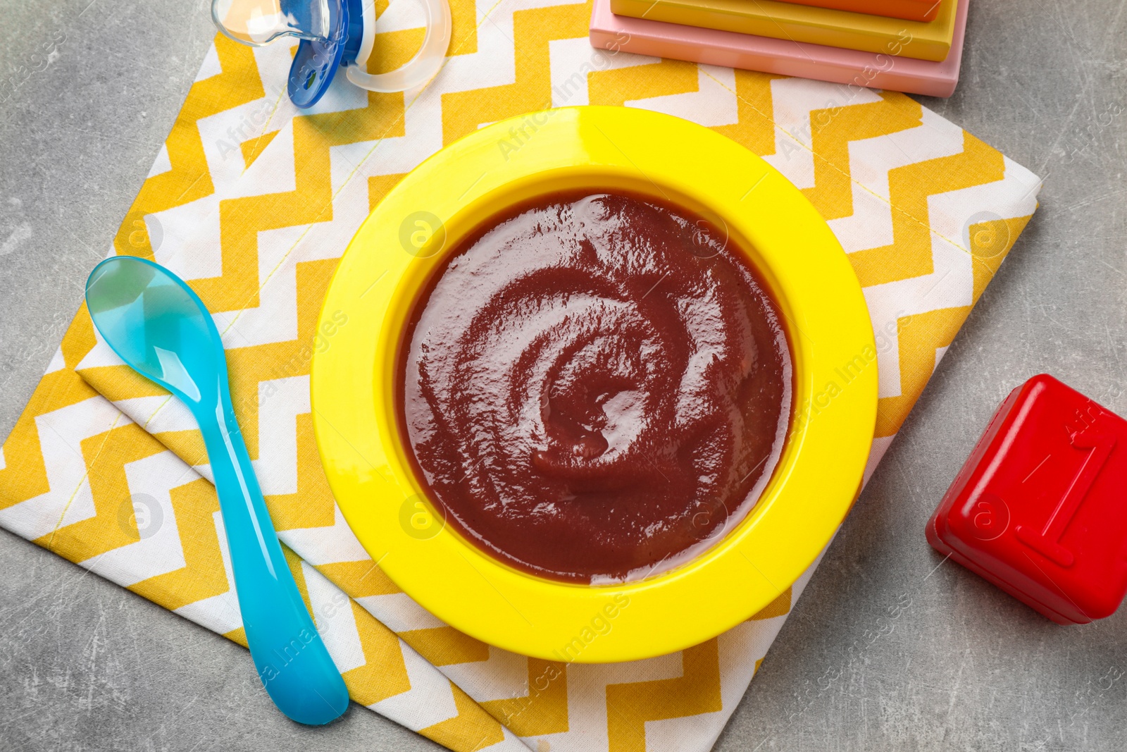 Photo of Flat lay composition with healthy baby food on grey table