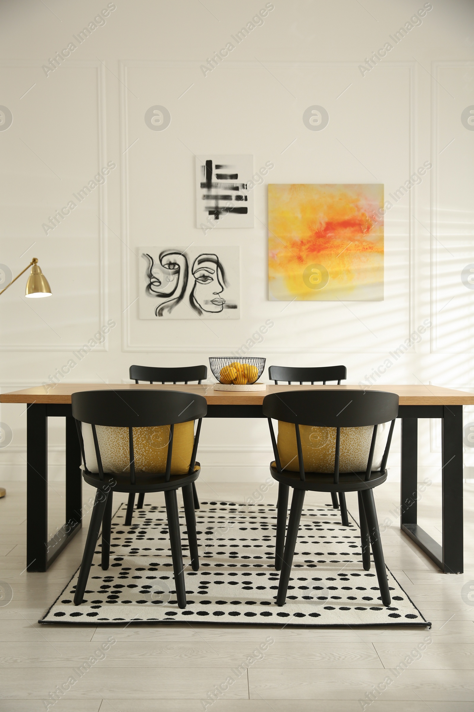 Photo of Stylish wooden dining table and chairs in room. Interior design