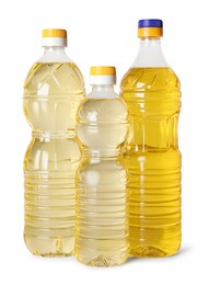 Photo of Bottles of cooking oil on white background