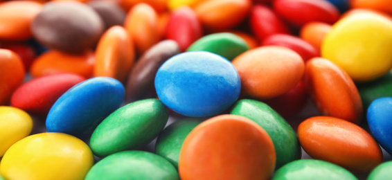 Image of Many colorful candies as background. Banner design 