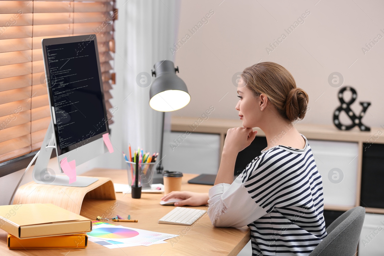 Image of Professional programmer working with computer in office