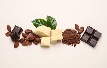 Photo of Flat lay composition with organic cocoa butter on beige background