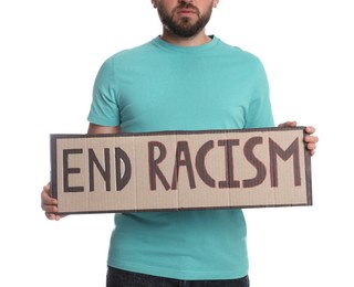 Young man holding sign with phrase End Racism on white background, closeup