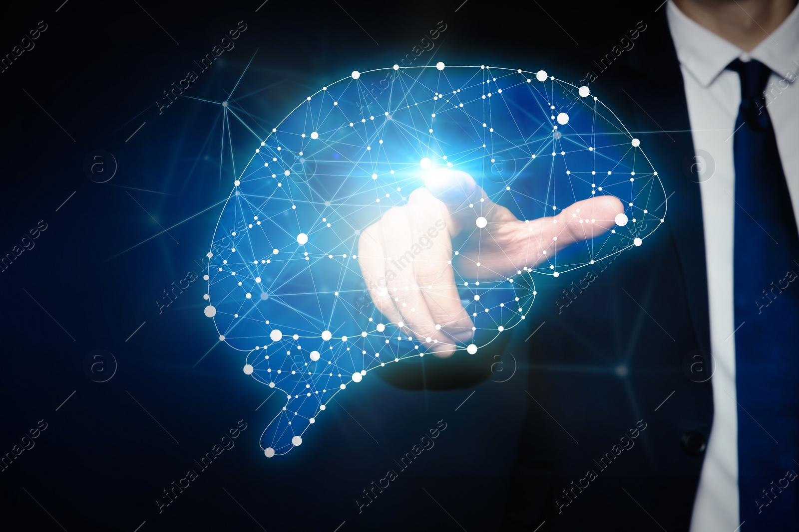 Image of Young man pointing at digital image of brain on blue background, closeup