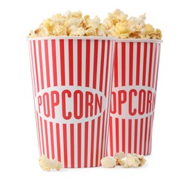 Photo of Tasty fresh popcorn in buckets isolated on white