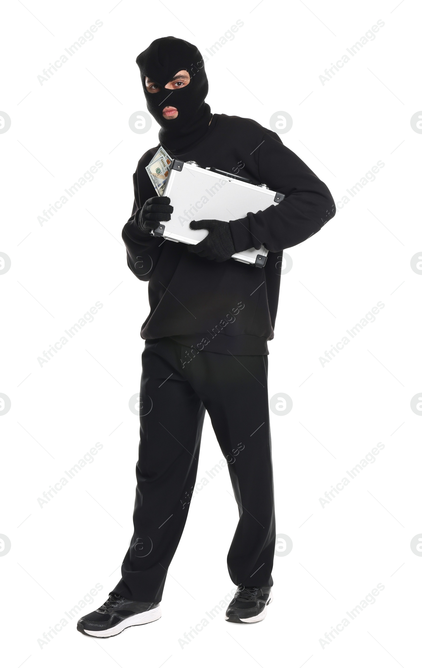 Photo of Thief in balaclava with briefcase of money on white background