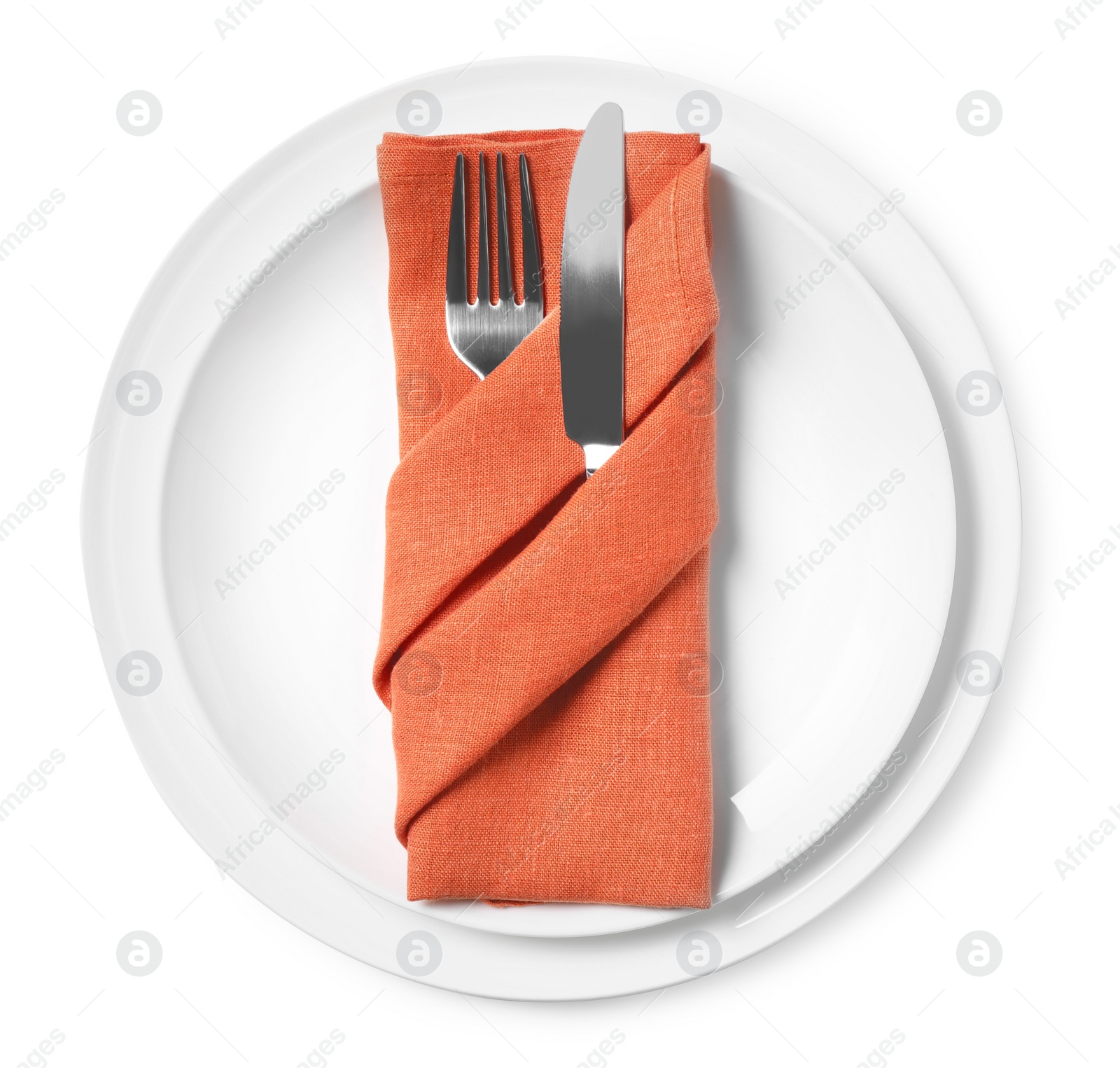 Photo of Plates with cutlery and napkin on white background, top view. Table setting