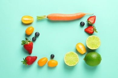 Photo of Flat lay composition with fresh berries, fruits and vegetable on color background