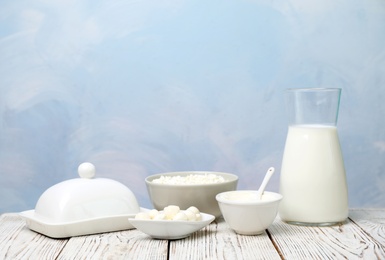 Different dairy products on wooden table