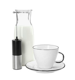 Mini mixer (milk frother), cup and bottle isolated on white