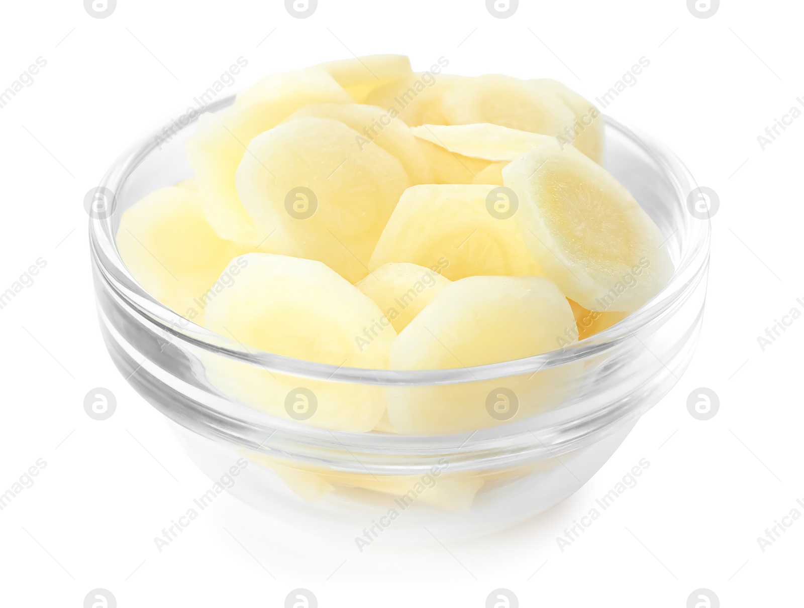 Photo of Pieces of raw carrot in glass bowl isolated on white