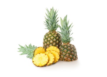 Image of Cut and whole pineapples isolated on white