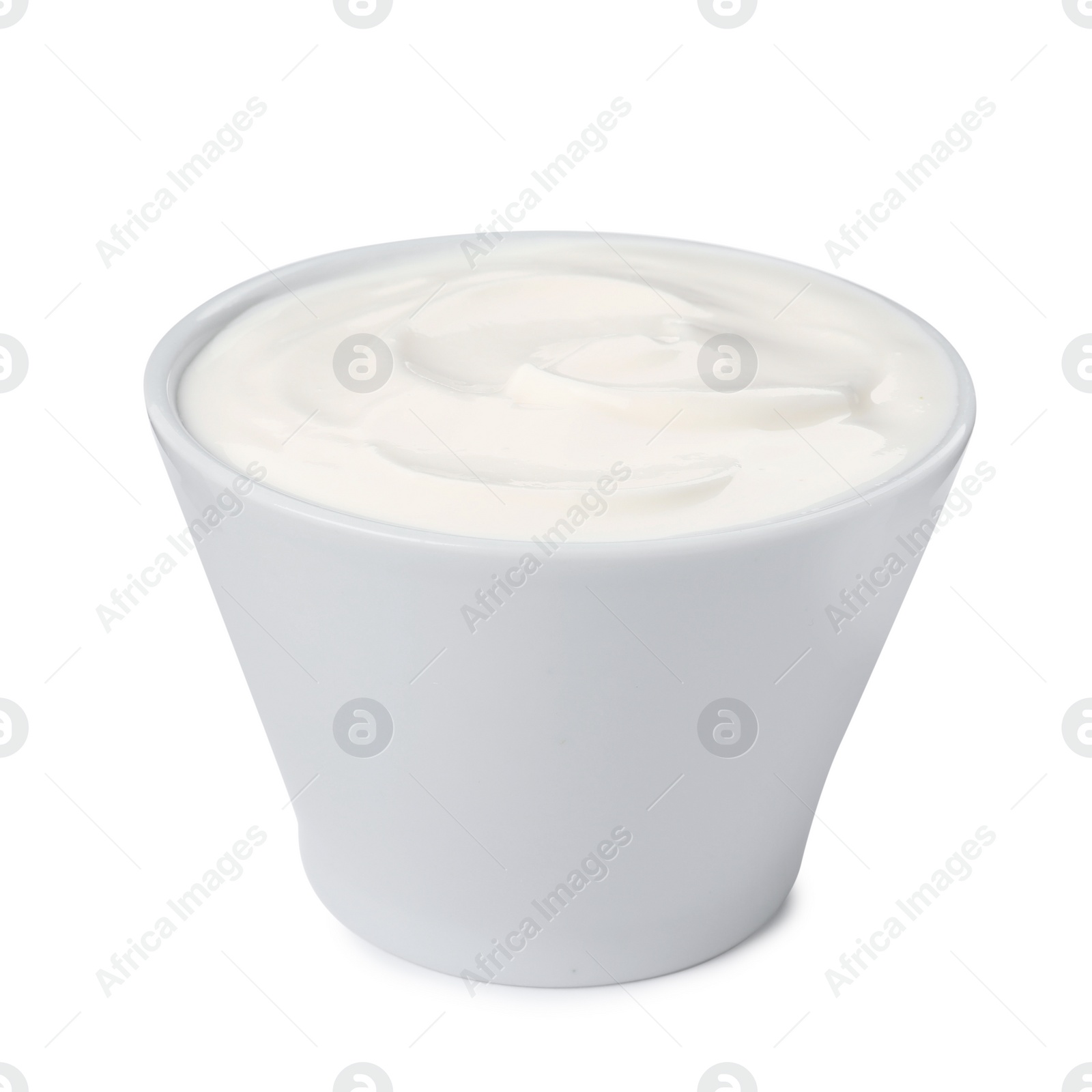 Photo of Bowl with delicious organic yogurt isolated on white