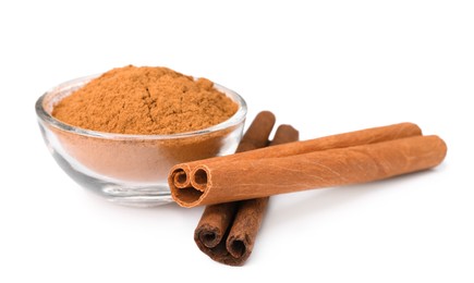 Dry aromatic cinnamon sticks and powder isolated on white