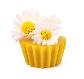 Photo of Natural beeswax cake block and flower isolated on white