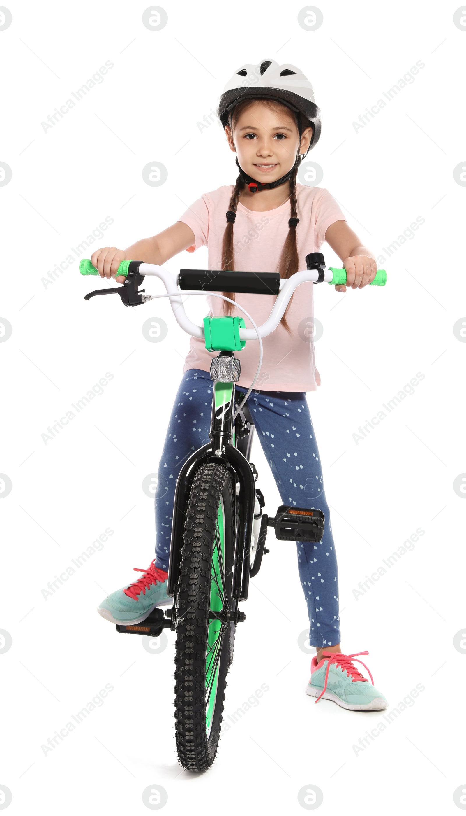 Photo of Portrait of cute little girl with bicycle on white background