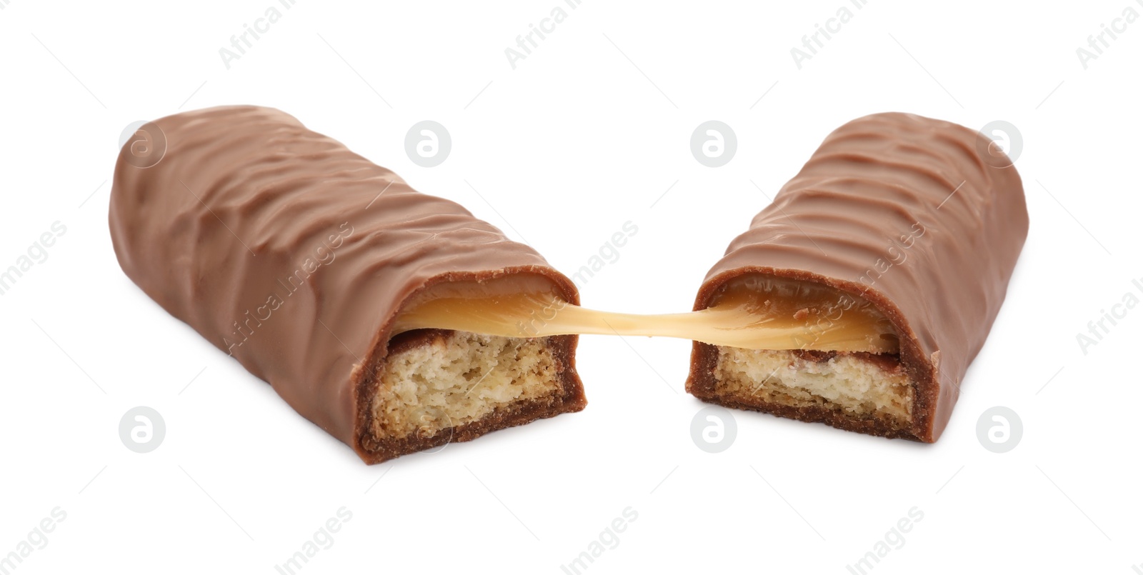 Photo of Pieces of chocolate bar with caramel on white background