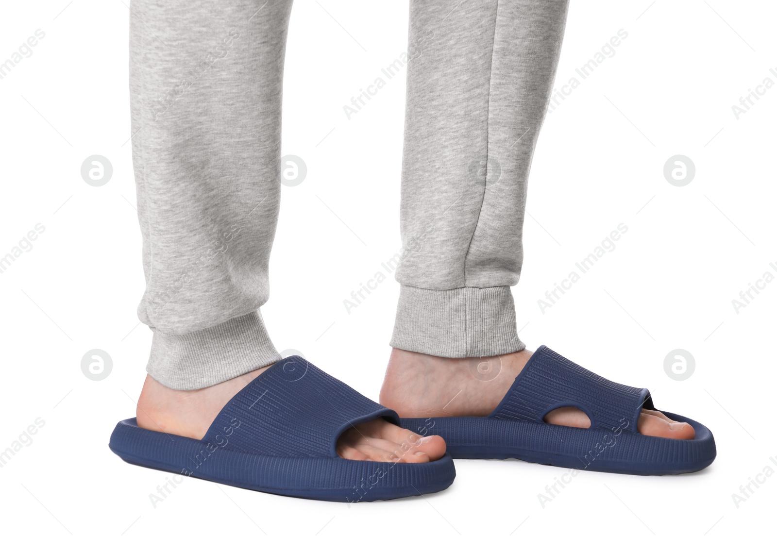 Photo of Man in blue slippers on white background, closeup