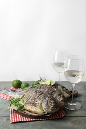 Seafood. Delicious baked fish served on rustic wooden table, space for text