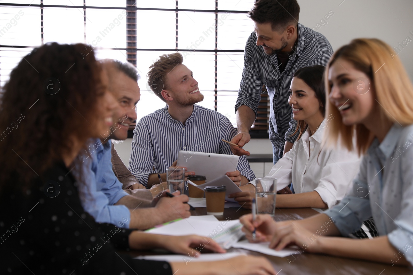 Photo of Portrait of volunteers having meeting in office