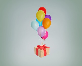 Many balloons tied to gift box on grey background