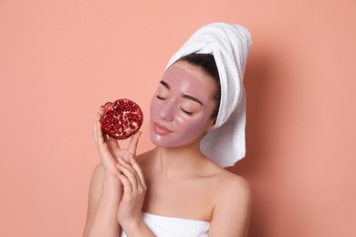 Woman with pomegranate face mask and fresh fruit on  pale coral background