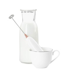 Milk frother wand, cup and glass carafe isolated on white