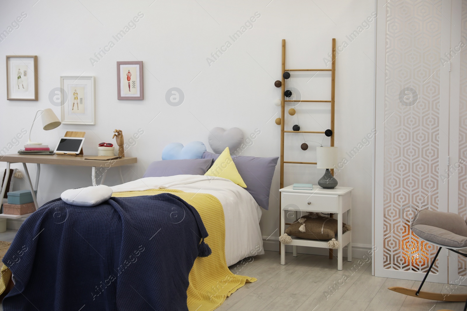 Photo of Modern teenager's room interior with comfortable bed