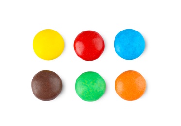 Tasty colorful candies on white background, top view