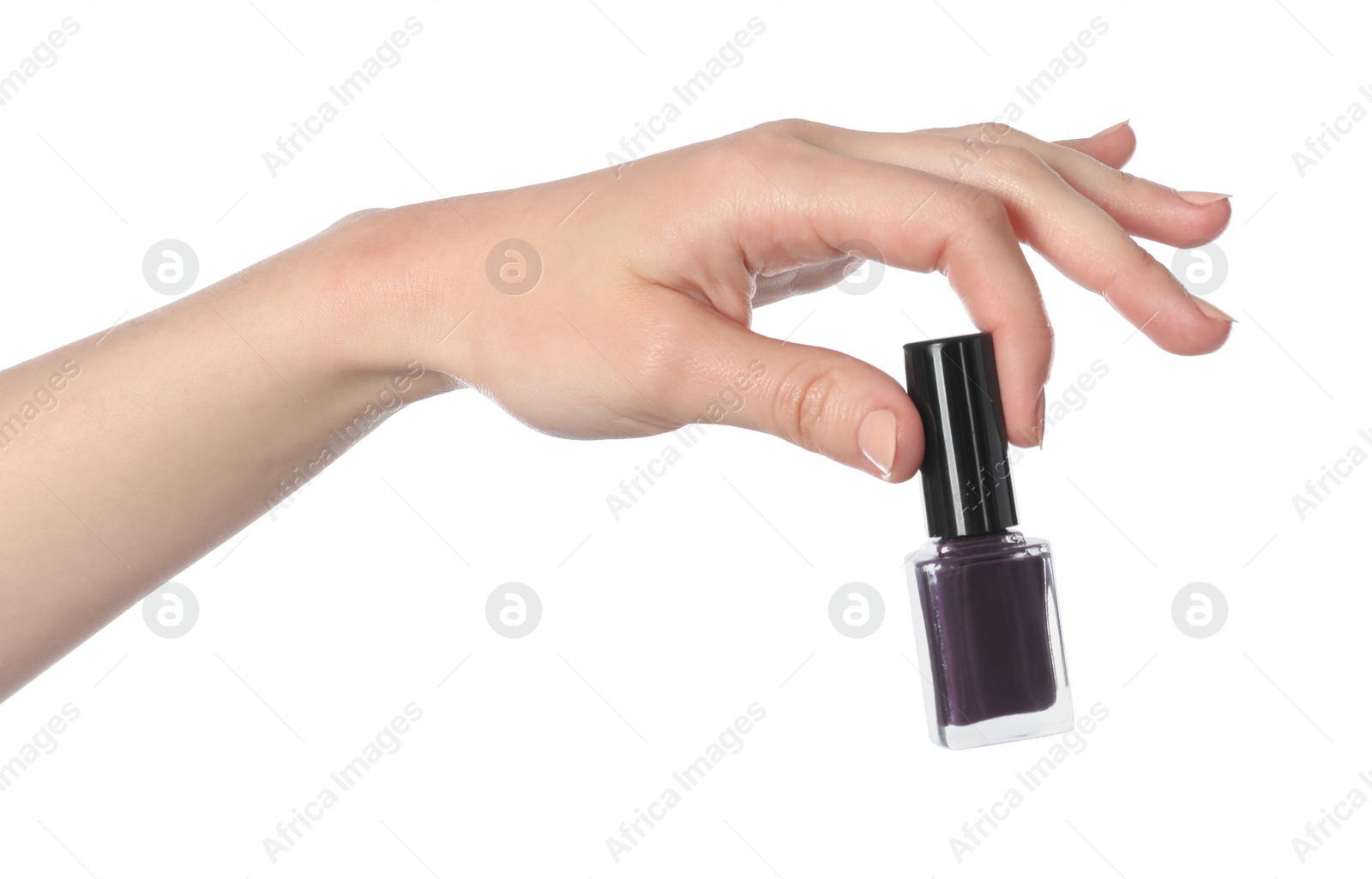 Photo of Woman holding nail polish on white background, closeup