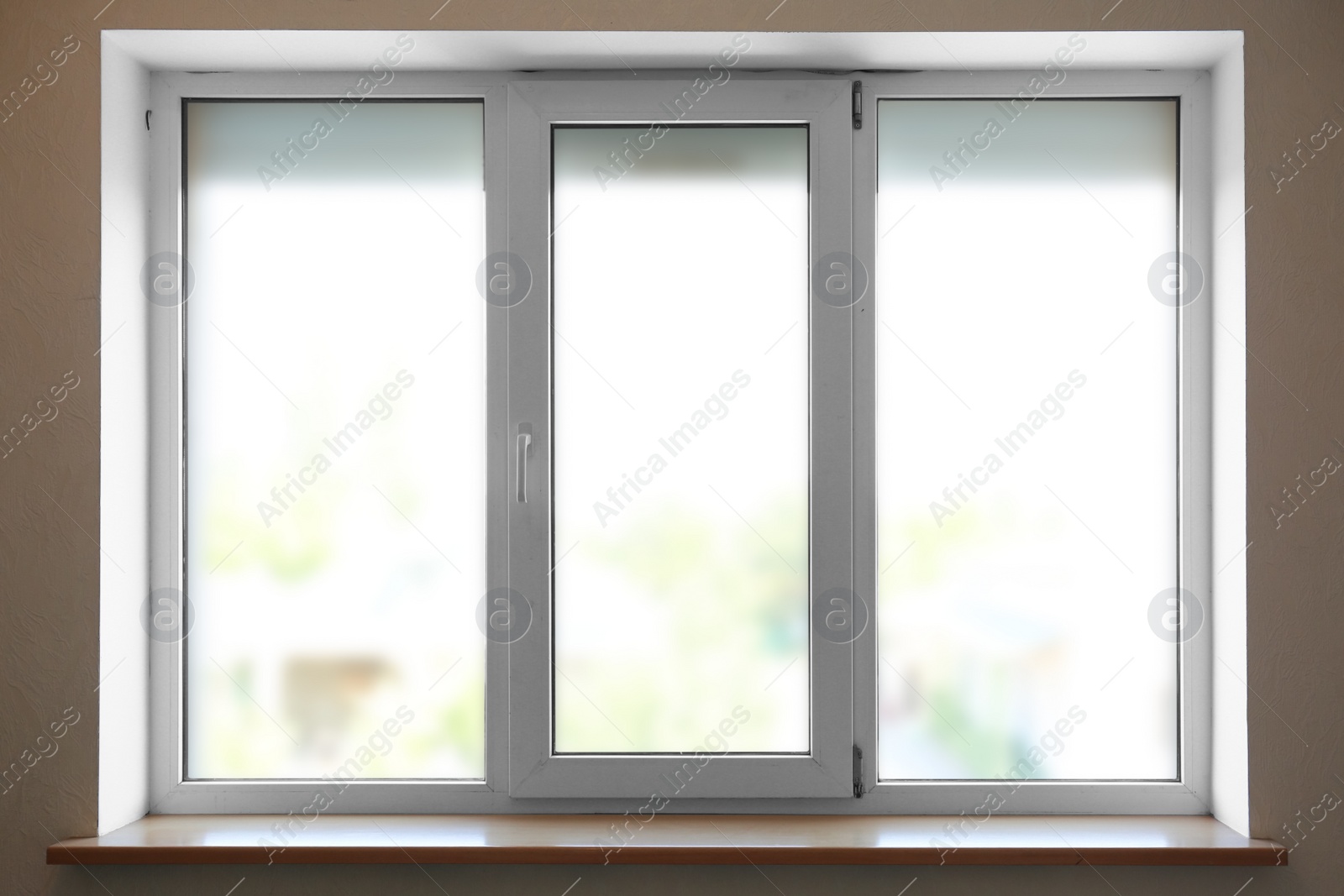 Photo of Modern plastic window with empty sill indoors