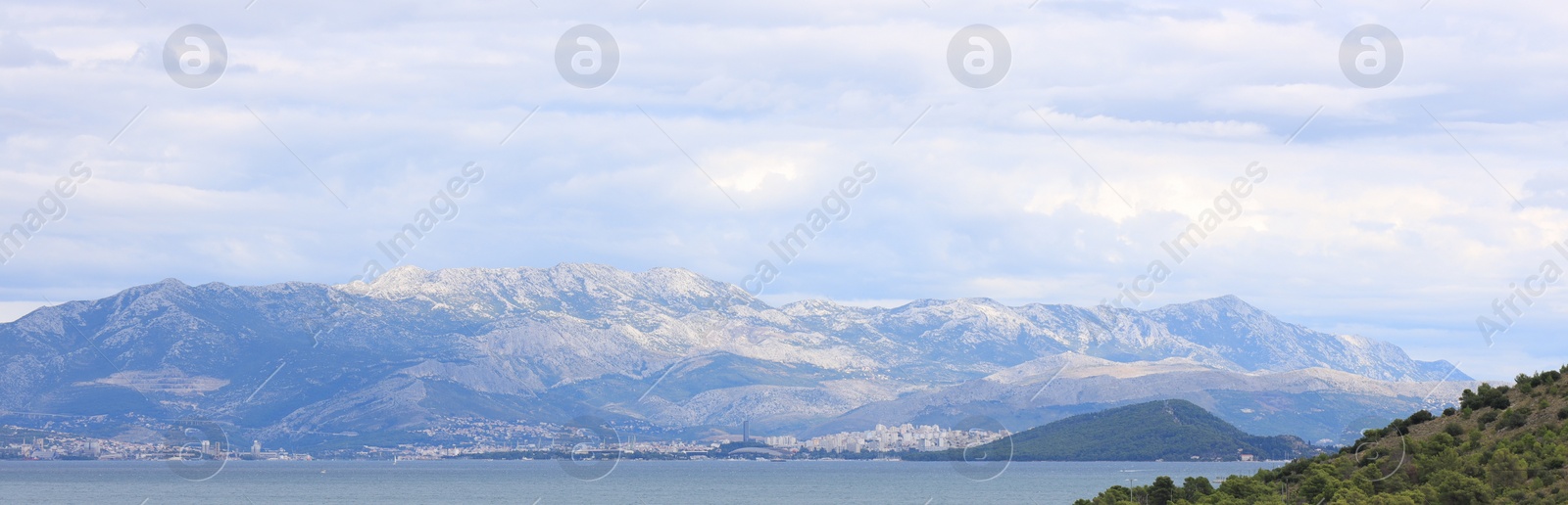 Image of Picturesque mountains and sea under beautiful sky, banner design