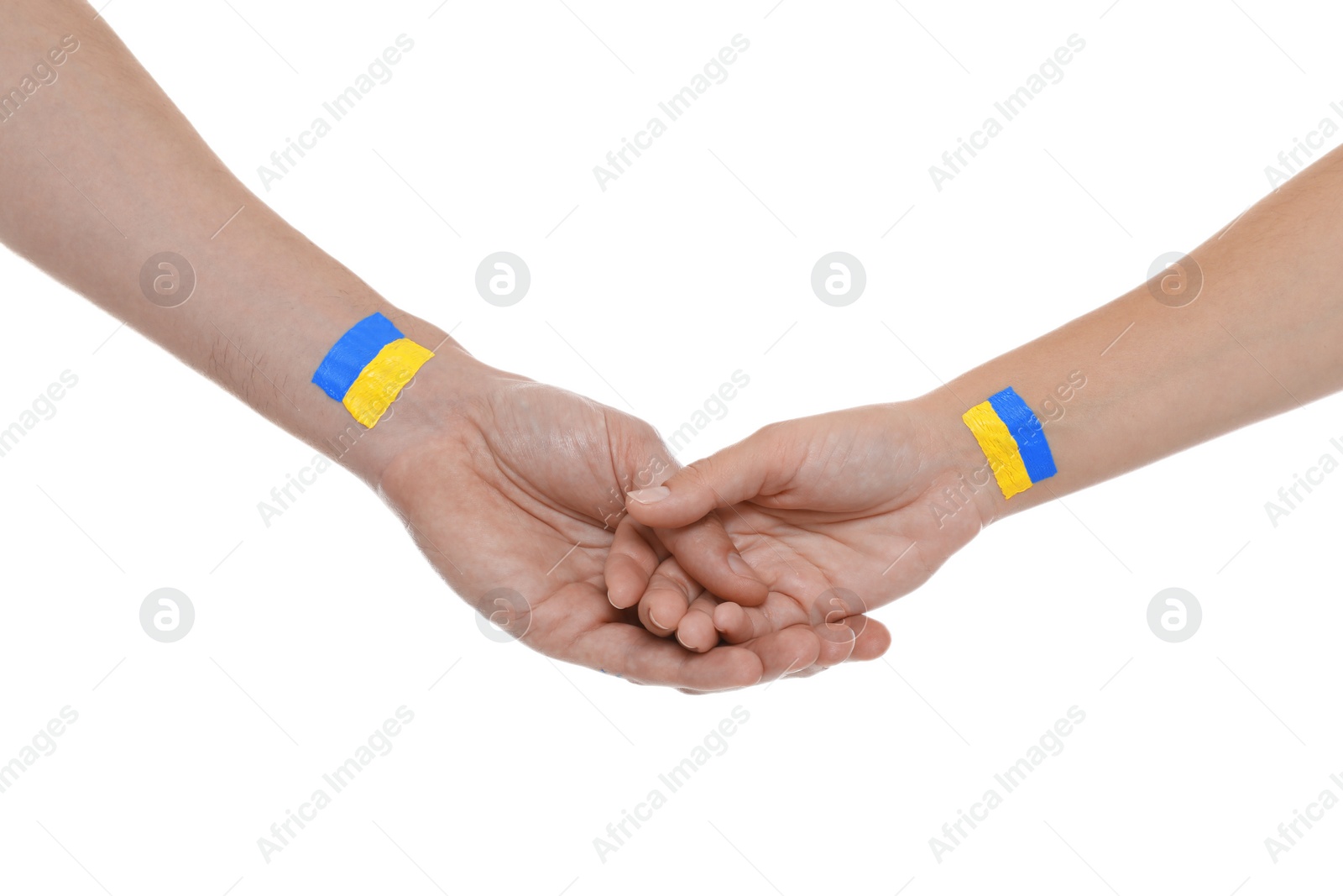 Photo of Man and woman with painted Ukrainian flags on their hands against white background, closeup