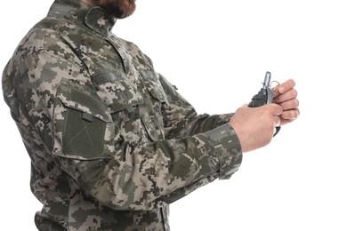 Photo of Soldier pulling safety pin out of hand grenade on white background, closeup. Military service