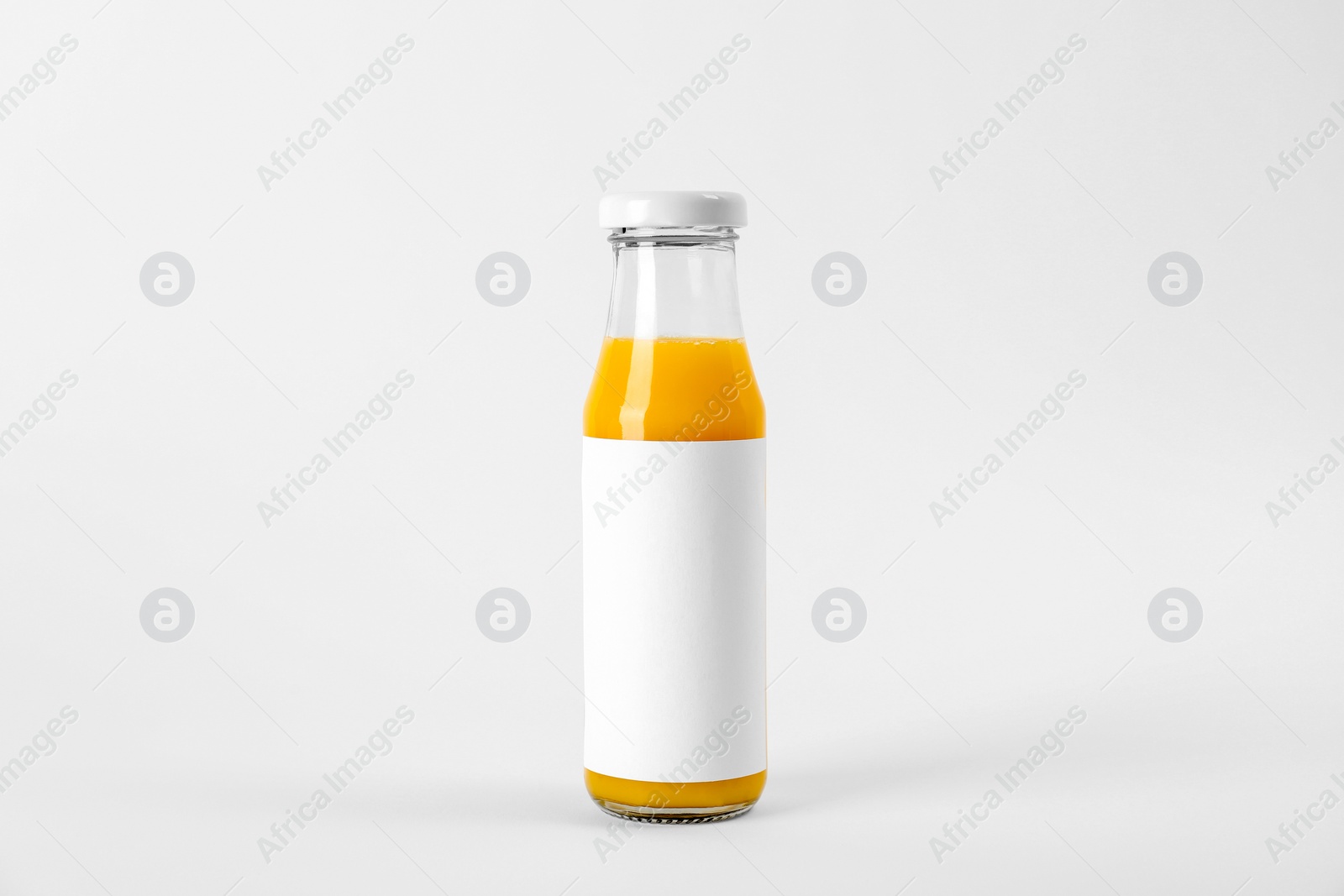 Photo of Bottle with delicious fresh juice on white background